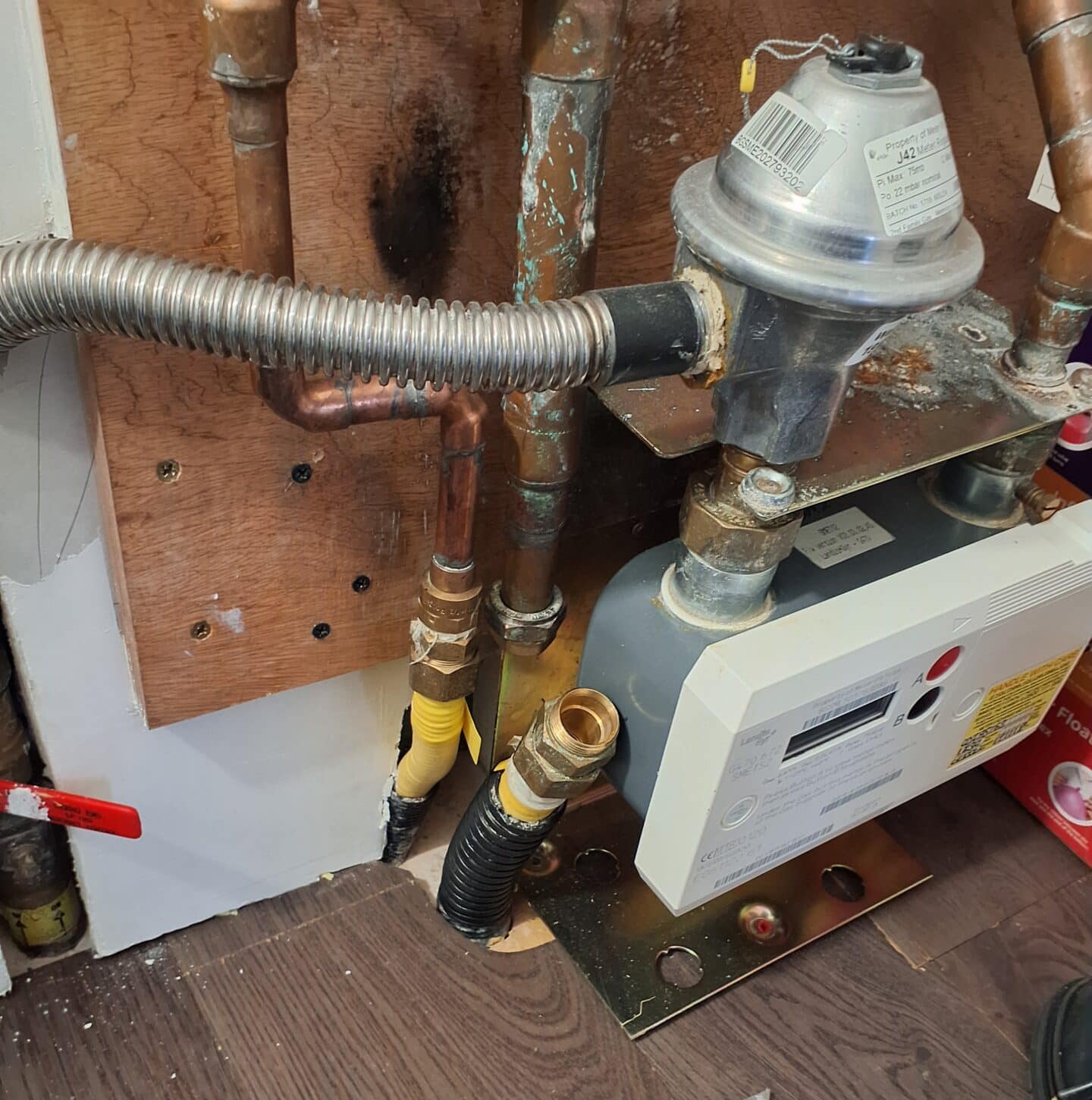 gas meter with leak identified. gas pipe removed for testing