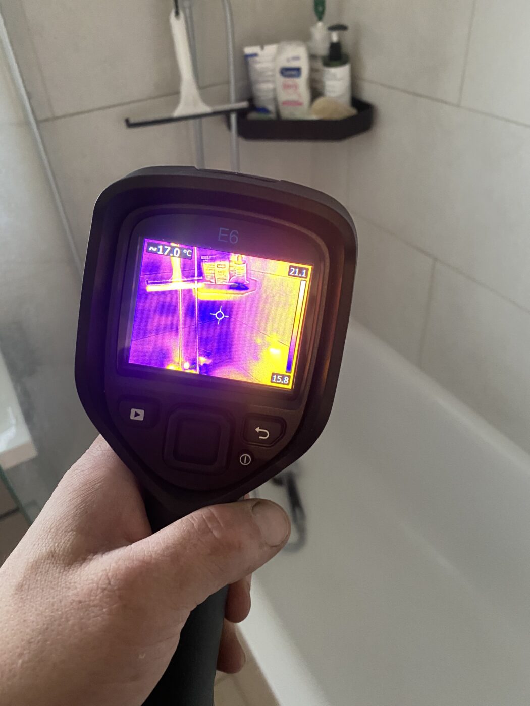 Thermal imaging camera checking bathroom for leaks